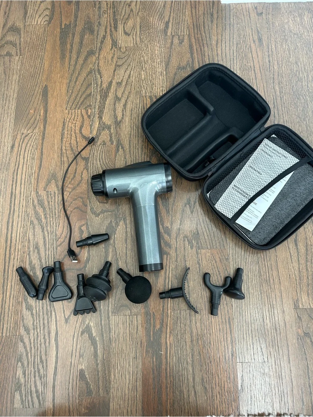 Gray Percussion Massage Gun with Multiple Attachments